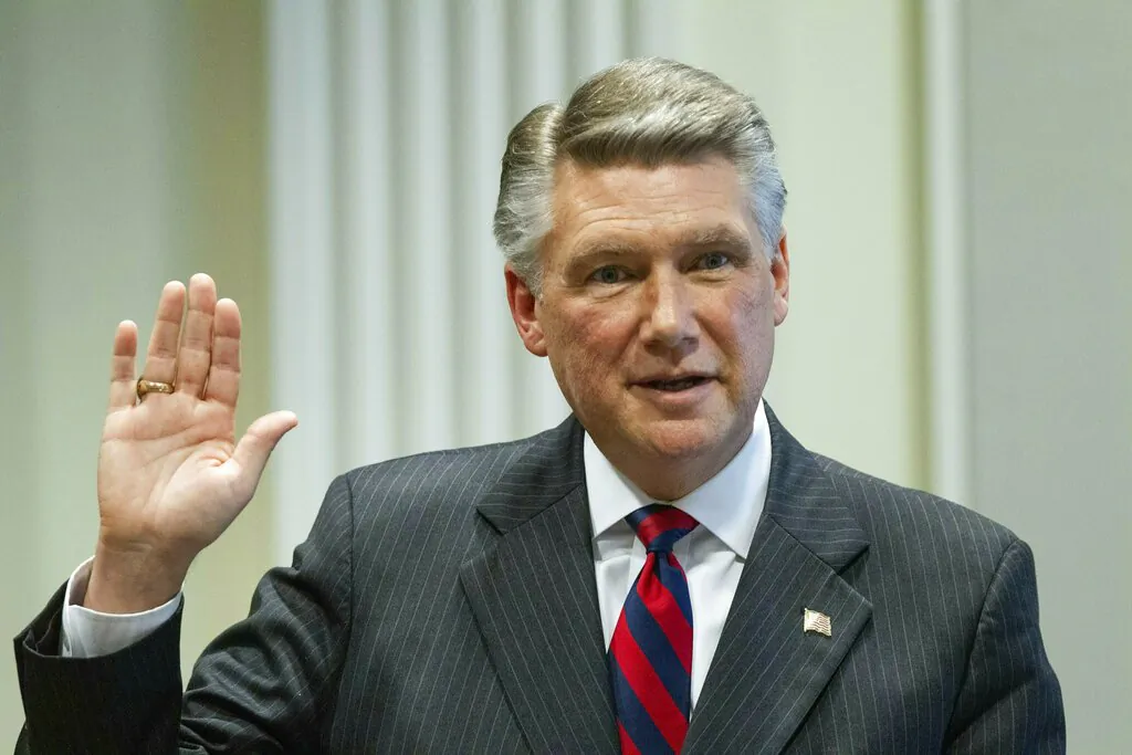 Mark Harris, Republican candidate in North Carolina's 9th Congressional race, prepares to testify during the fourth day of a public evidentiary hearing on the 9th Congressional District voting irregularities investigation Thursday, Feb. 21, 2019, at the North Carolina State Bar in Raleigh, N.C. (Travis Long//The News & Observer/AP/Pool)