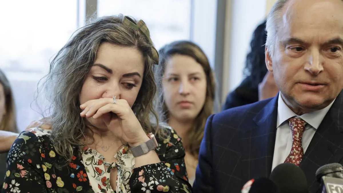 RaDonda Vaught, left, wipes away tears as her attorney, Peter Strianse, right, talks with reporters after a court hearing in Nashville, Tenn. on Feb. 20, 2019 (Mark Humphrey/AP Photo)