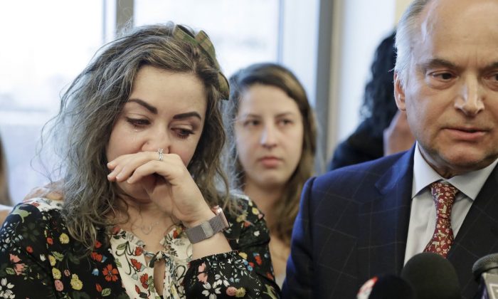 RaDonda Vaught, left, wipes away tears as her attorney, Peter Strianse, right, talks with reporters after a court hearing in Nashville, Tenn.  on Feb. 20, 2019 (Mark Humphrey/AP Photo)