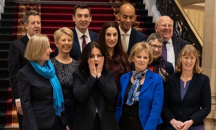 Former Conservative Party and now Independent MPs (front L-R) Sarah Wollaston, Heidi Allen, with the former Labour Party members of The Independent Group of MPs, Joan Ryan (front row R), (middle row L-R) Angela Smith, Luciana Berger, Ann Coffey (top row L-R) Chris Leslie, Gavin Shuker, Chuka Umunna, and Mike Gapes in London on Feb. 20, 2019. (Niklas Halle'n/AFP/Getty Images)