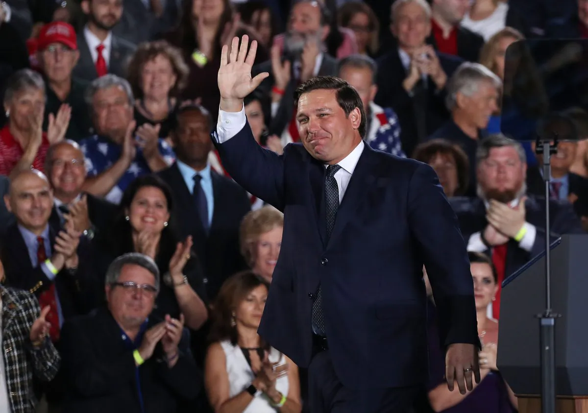Florida Governor Ron DeSantis waves after speaking about Venezuela before the arrival of President Donald Trump during a rally at Florida International University  on February 18, 2019 in Miami, Florida. (Joe Raedle/Getty Images)