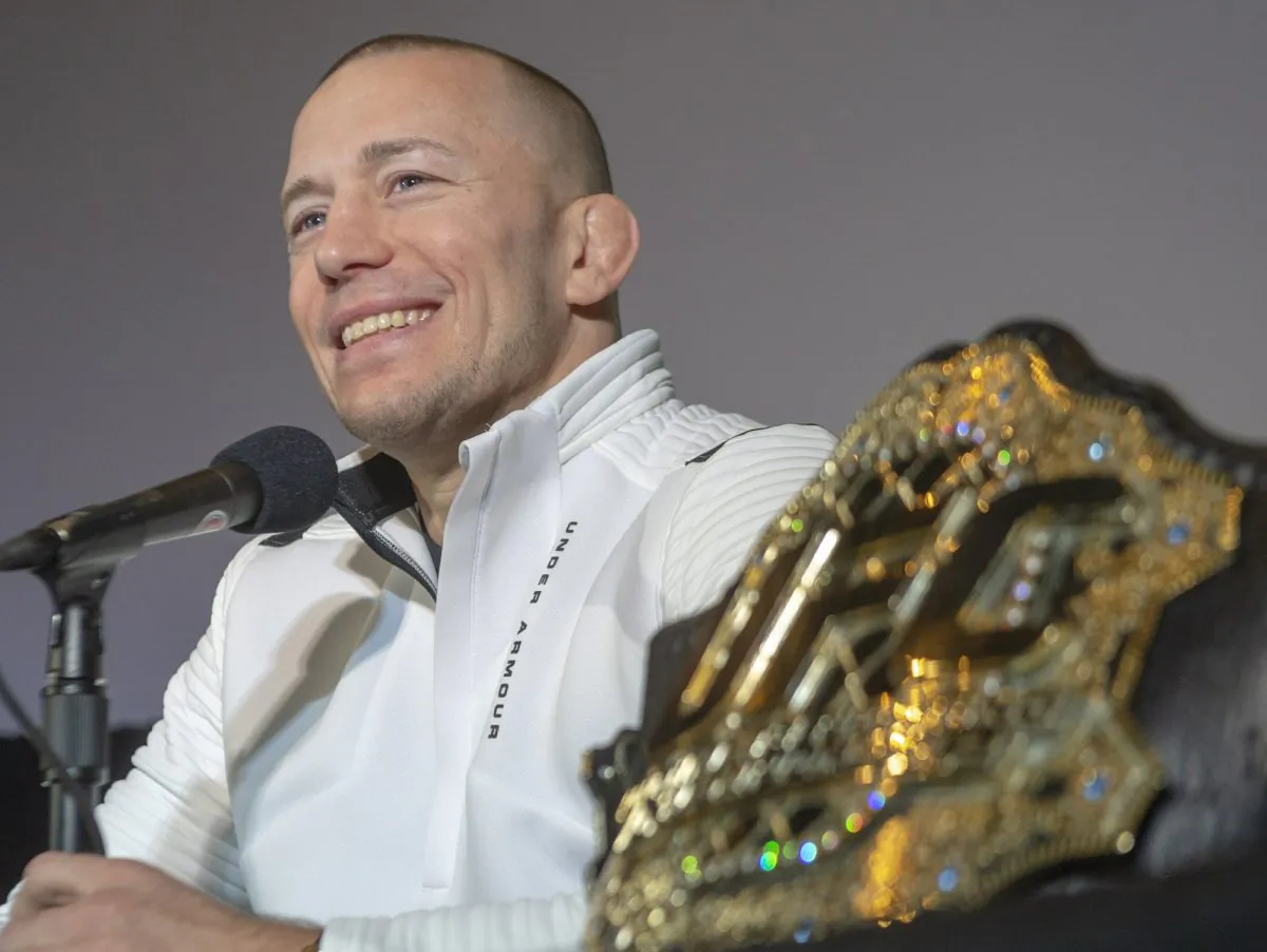 Canada's Georges St-Pierre announces his retirement from mixed martial arts during a press conference in Montreal, on Feb. 21, 2019. (Ryan Remiorz/The Canadian Press via AP)