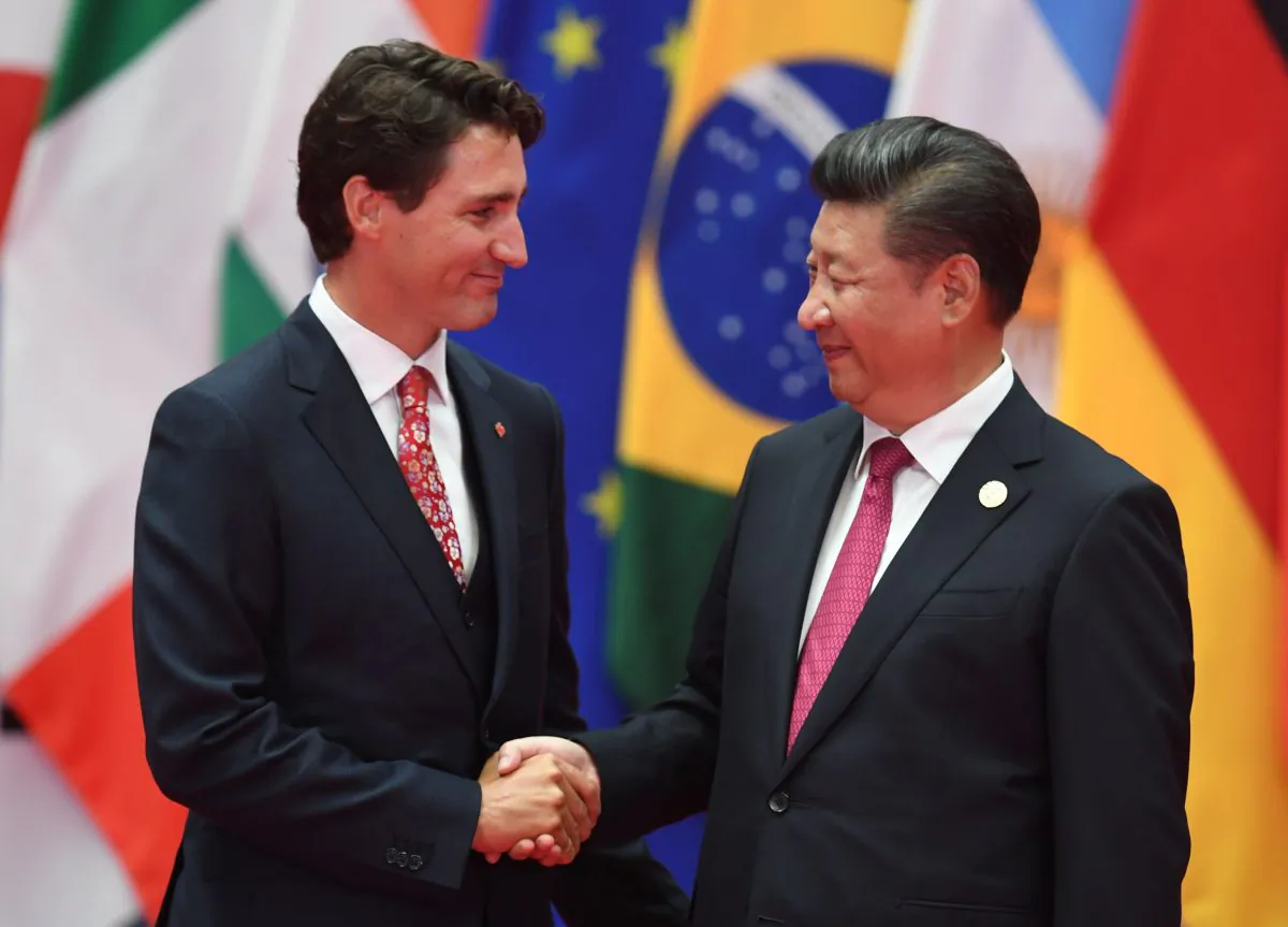 Canadian Prime Minister Justin Trudeau shakes hands with Chinese leader Xi Jinping during the G20 summit in Hangzhou, China, on Sept. 4, 2016. (Greg Baker/AFP/Getty Images)