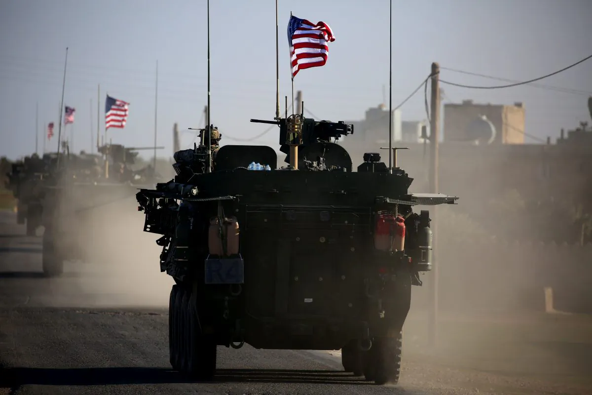 A convoy of U.S. forces armored vehicles drives near the village of Yalanli, on the western outskirts of the northern Syrian city of Manbij, on March 5, 2017. (Delil Souleiman/AFP/Getty Images)