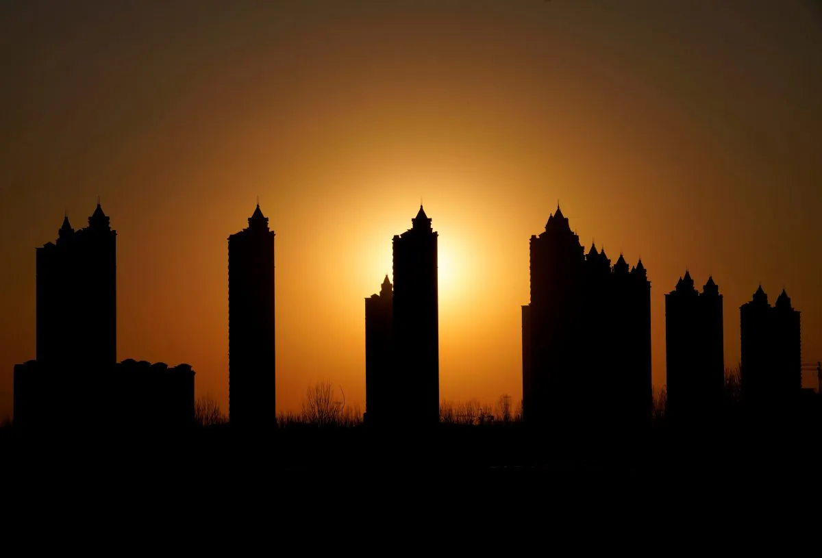 Apartment blocks are pictured during sunset on the outskirts of Tianjin, China on Feb. 2, 2018. (Jason Lee/Reuters)