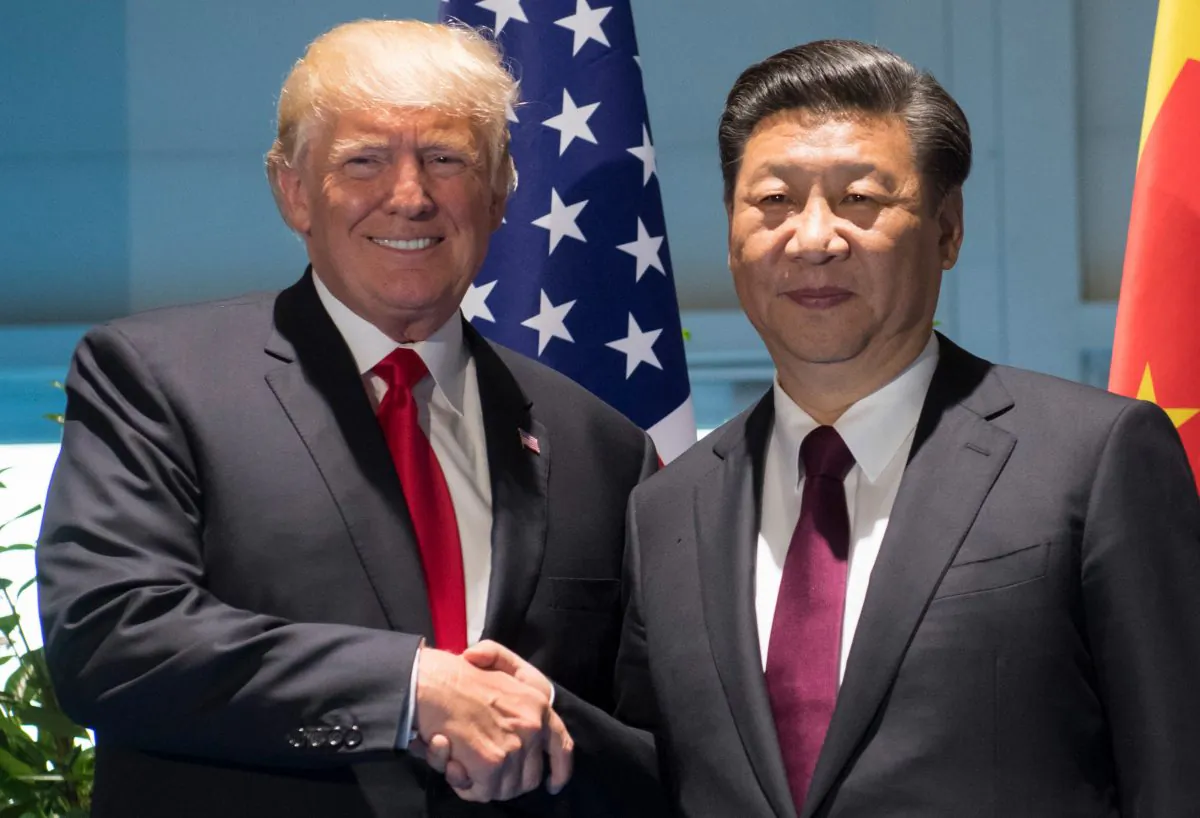 President Donald Trump and Chinese leader Xi Jinping shake hands prior to a meeting on the sidelines of the G20 Summit in Hamburg, Germany, on July 8, 2017. (Saul Loeb/AFP/Getty Images)