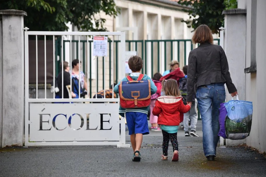 Pupils arrive at a primary school on the first day of the new school year in La Rochelle, France, on Sept. 4, 2017. XAVIER LEOTY/AFP/Getty Images