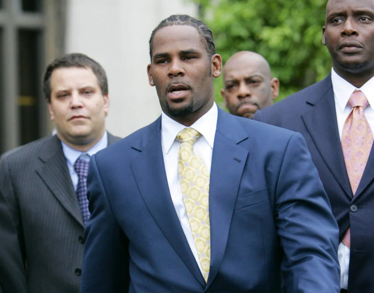R&B singer R. Kelly leaves the Cook County Criminal Court Building in Chicago after a jury found him not guilty on all counts in his child pornography trial on June 13, 2008. (Nam Y. Huh/AP Photo)