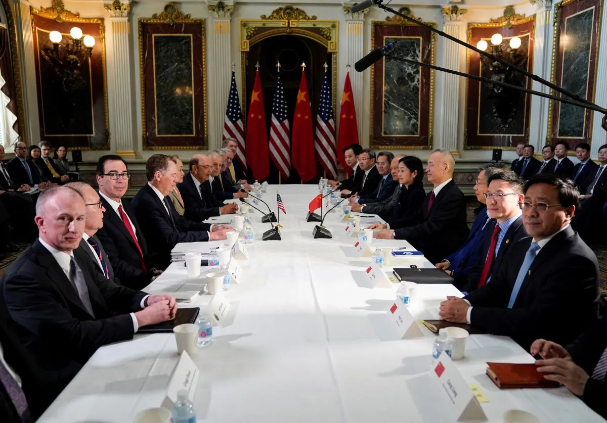 U.S. Trade Representative Robert Lighthizer (4th L), Treasury Secretary Steven Mnuchin (3rd L), Commerce Secretary Wilbur Ross, White House economic adviser Larry Kudlow, and White House trade adviser Peter Navarro pose for a photograph with China’s Vice Premier Liu He (4th R), Chinese vice ministers, and senior officials before the start of U.S.-China trade talks at the White House on Feb. 21, 2019. (Joshua Roberts/Reuters)
