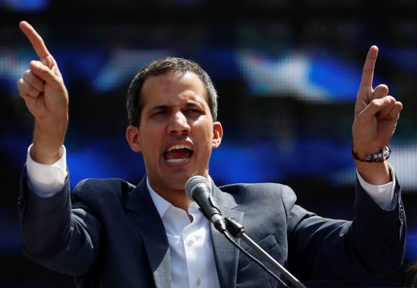 Venezuelan opposition leader and self-proclaimed interim president Juan Guaido gestures 