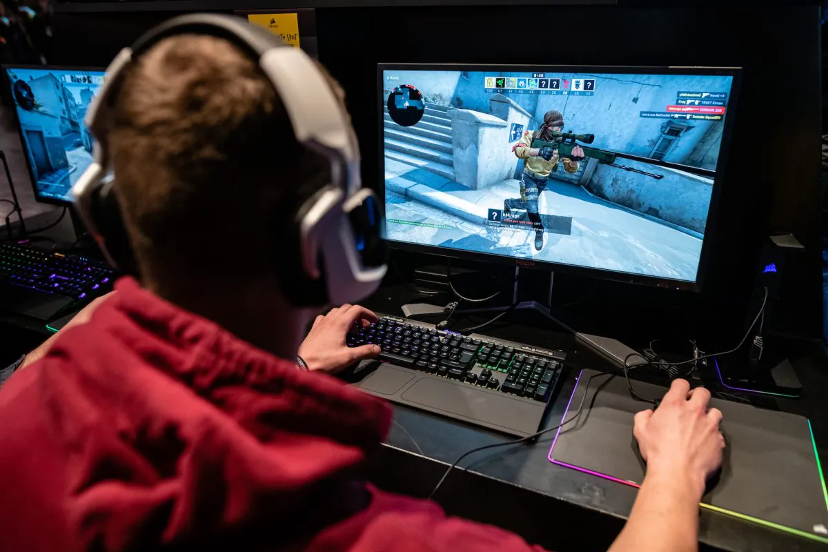 A participant sits at a computer monitor to play a video game at the 2019 DreamHack video gaming festival in Leipzig, Germany, on Feb. 15, 2019. (Jens Schlueter/Getty Images)