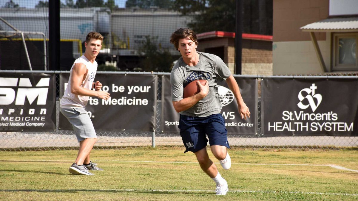 two boys play football