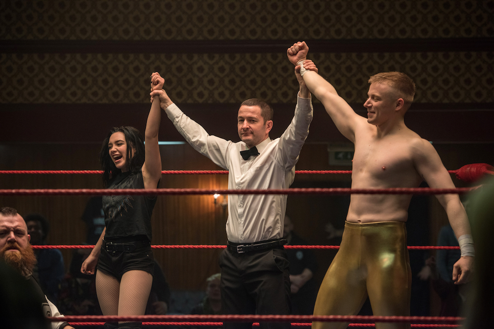 two wrestlers and referee in ring