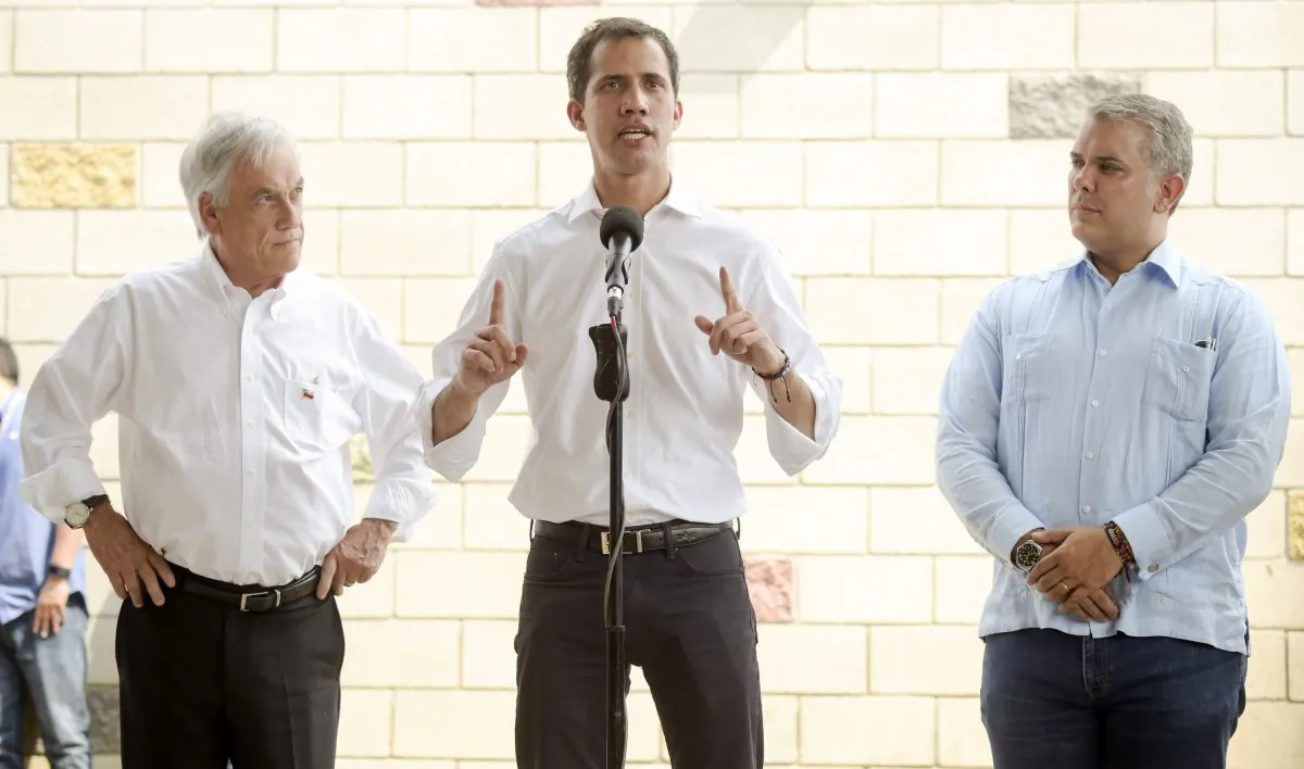 Venezuelan interim president Juan Guaido (C) speaks during a press conference, flanked by presidents Ivan Duque (R) of Colombia and Sebastian Pinera of Chile (L) in Cucuta on the Colombian side of the Tienditas International Bridge before the attempt to cross humanitarian aid over the border into Venezuela on Feb. 23, 2019. (Raul Arboleda/AFP/Getty Images)