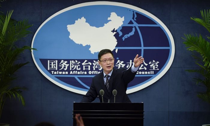 An Fengshan, spokesman for the State Council's Taiwan Affairs Office, gestures toward the media at a press conference in Beijing on Dec. 28, 2016. (Wang Zhao/AFP/Getty Images)