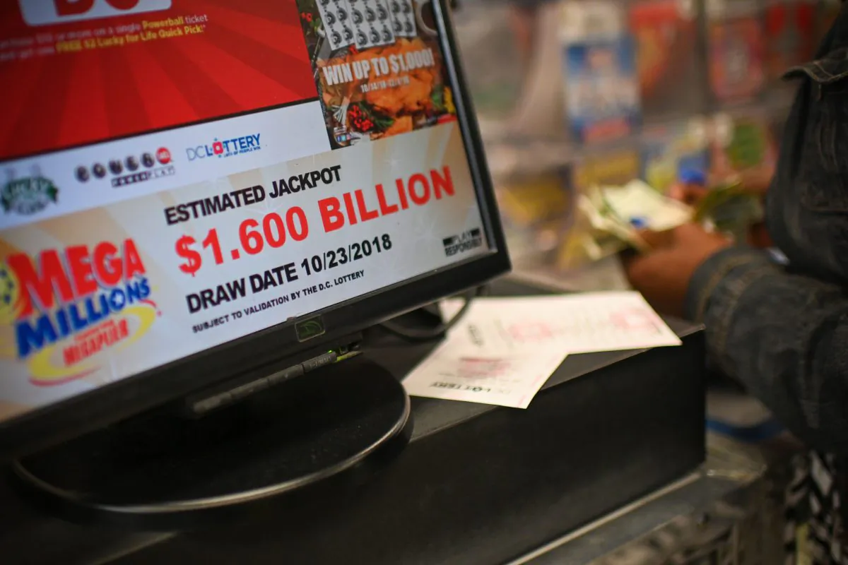 A woman buys Mega Millions tickets hours before the draw of the $1.6 billion jackpot, at a liquor store in Downtown Wash. DC, on Oct. 23, 2018. (Eric Baradat/AFP/Getty Images)