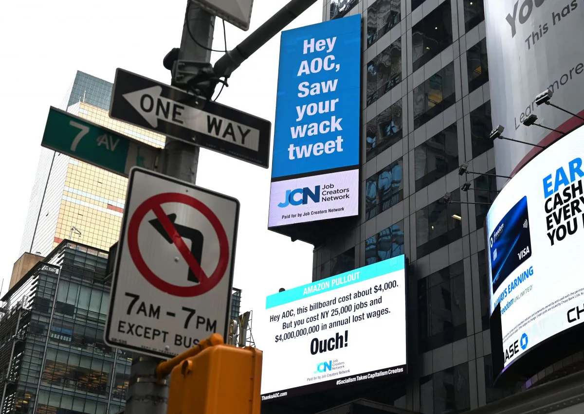 Signs placed by the Job Creators Network are seen on Times Square in New York on Feb. 23, 2019. (Timothy A. Clary/AFP) 