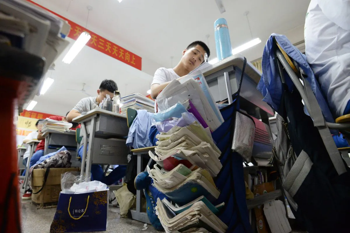 High school students go through exam papers ahead of the annual "Gaokao," or college entrance examinations, in Handan City, Hebei Province, China, on May 23, 2018.  (AFP/Getty Images)
