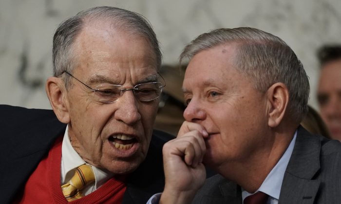 Senate Judiciary Committee Chairman Lindsey Graham (R) (R-S.C.) confers with former committee chairman Sen. Chuck Grassley (L) (R-IA) during a committee hearing in Washington on Jan. 15, 2019. (Alex Wong/Getty Images)