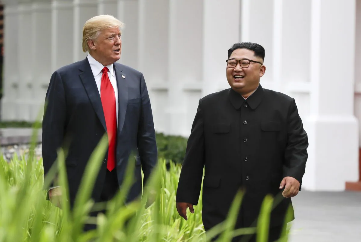 President Donald Trump and North Korea leader Kim Jong Un walk from their lunch at the Capella resort on Sentosa Island in Singapore on June 12, 2018. (Evan Vucci/AP Photo)