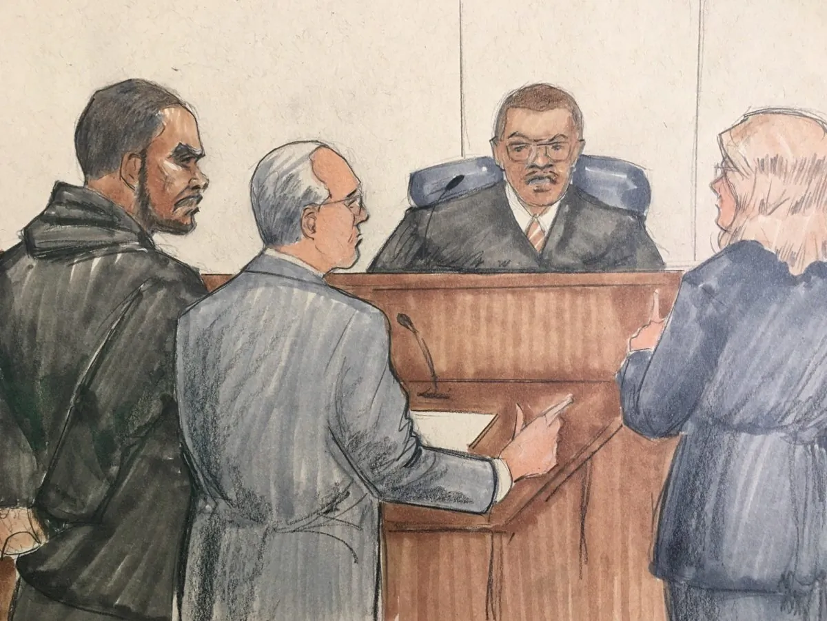 R&B singer R. Kelly, attorney Steve Greenberg, and prosecutor Jennifer Gonzalez appear before Cook County Judge John Fitzgerald Lyke Jr. at the Leighton Criminal Courthouse, Chicago, on Feb. 23, 2019. (AP Photo/Tom Gianni)
