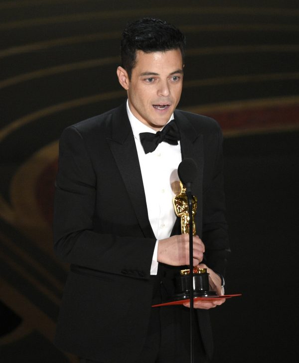 Rami Malek accepts the award for best performance