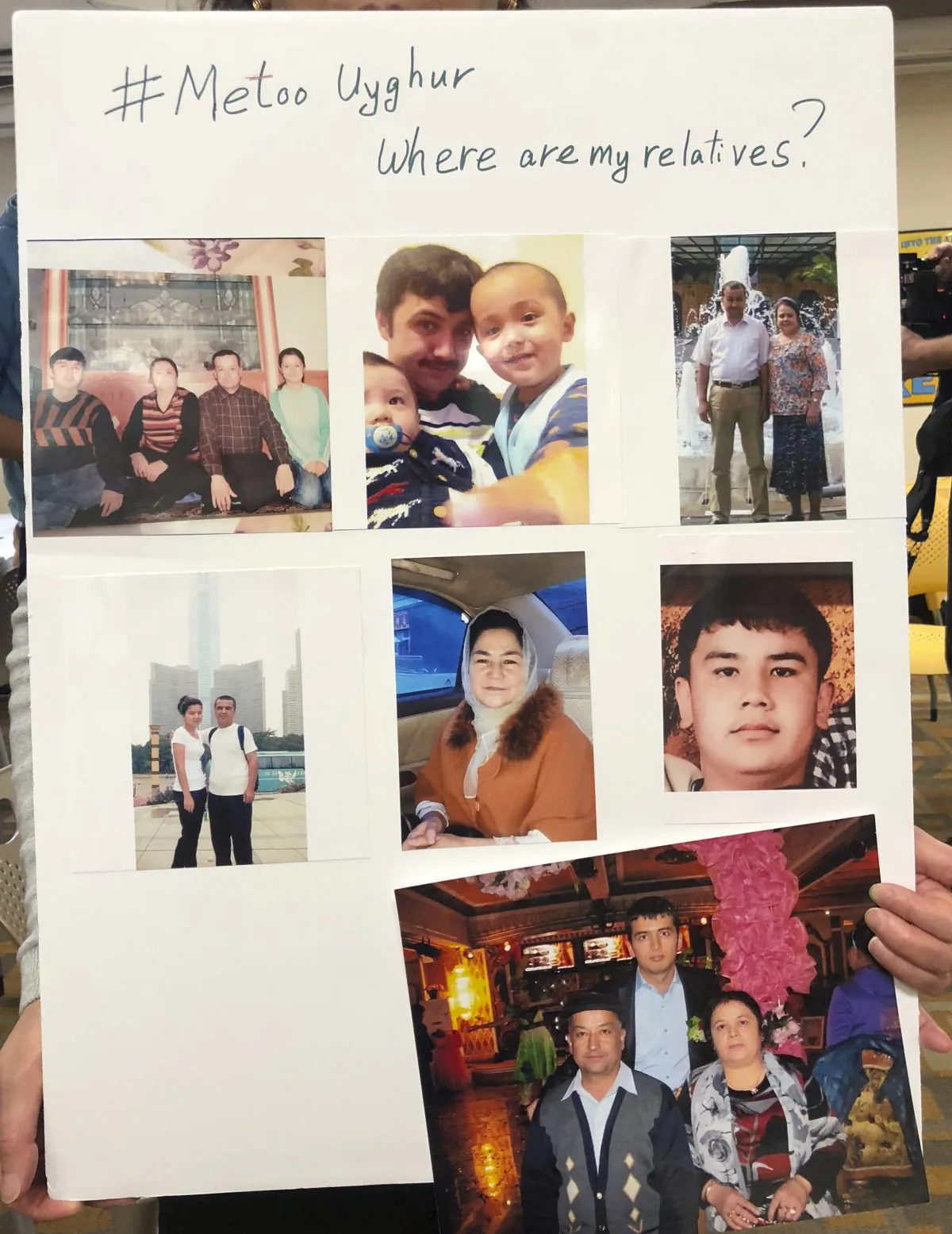 A poster showing missing relatives is displayed during a gathering to raise awareness about loved ones who have disappeared in China's far west in Washington DC on Feb. 24, 2019. (Christina Larsen/AP)