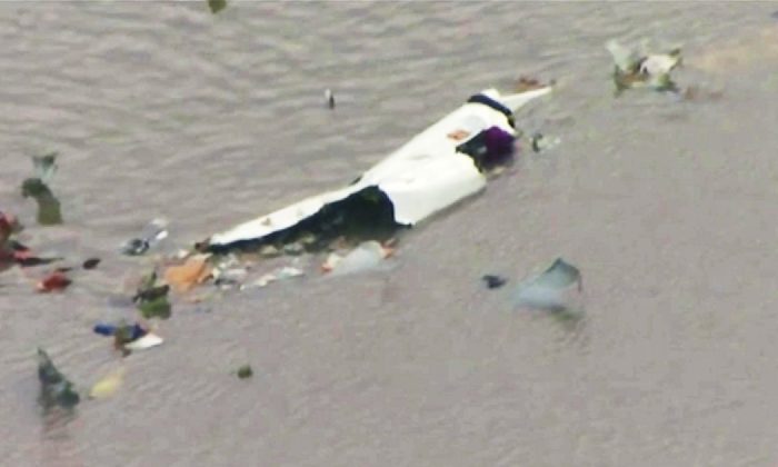 This image shows the scene of a cargo plane crash in Trinity Bay, just north of Galveston Bay and the Gulf of Mexico in Texas on Feb. 23, 2019. (KRIV FOX 26 via AP)