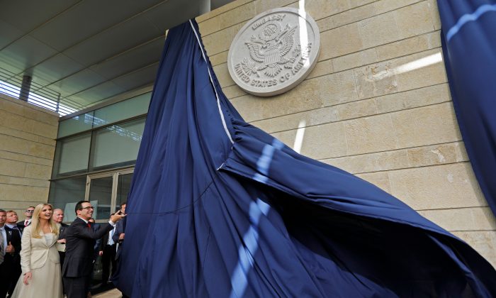 US Treasury Secretary Steve Mnuchin and US President's daughter Ivanka Trump unveil an inauguration plaque during the opening of the US embassy in Jerusalem on May 14, 2018. MENAHEM KAHANA/AFP/Getty Images