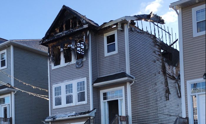 The aftermath of a house fire is seen in the Spryfield community in Halifax on Feb. 19, 2019. (Rob Roberts/The Canadian Press)