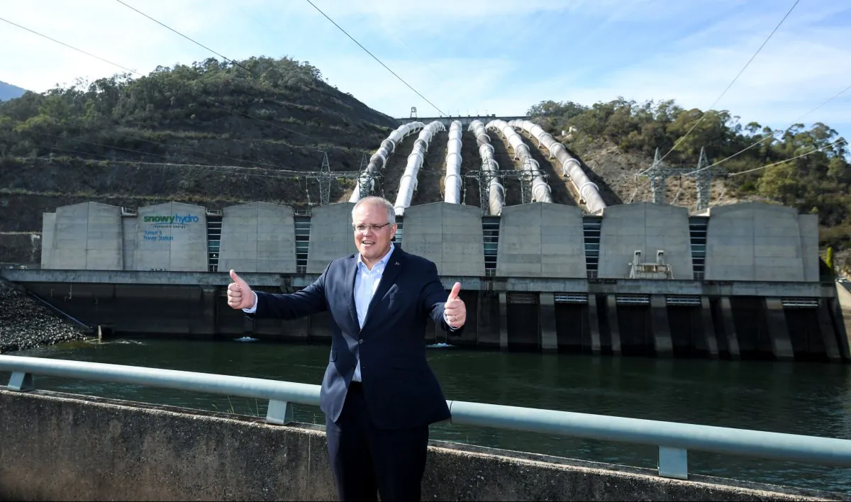 Australia's Prime Minister Scott Morrison poses for photographs in front of the Tumut 3 power station at the Snowy Hydro Scheme in Talbingo, Australia, on Feb. 26, 2019. (AAP Image/Lukas Coch)