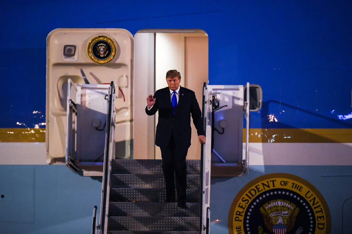 President Donald Trump waves while disembarking from Air Force One at Noi Bai International Airport in Hanoi on Feb. 26, 2019. (MANAN VATSYAYANA/AFP/Getty Images)