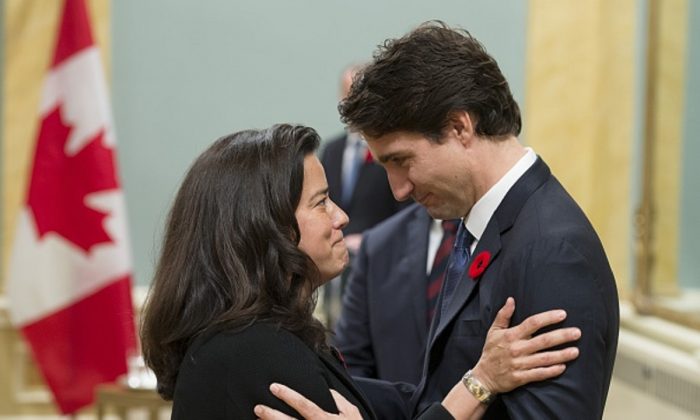 Canadian Prime Minister Justin Trudeau speaks with Minister of Justice Jody Wilson-Raybould during a swearing-in ceremony at Rideau Hall in Ottawa, on Nov. 4, 2015. (Adrian Wyld/AFP/Getty Images)