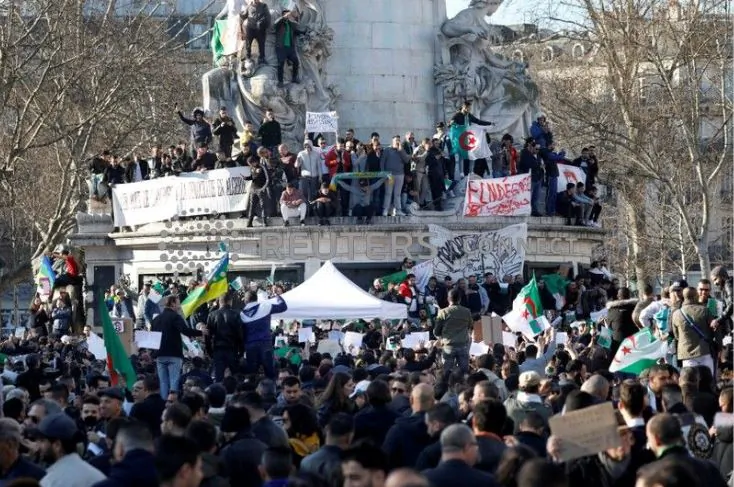 Demonstrators gather around the Monument to the Republic during a protest against President Abdelaziz Bouteflika seeking a fifth term in a presidential election set for April 18, in Paris, France, Feb. 24, 2019. (Charles Platiau/Reuters)
