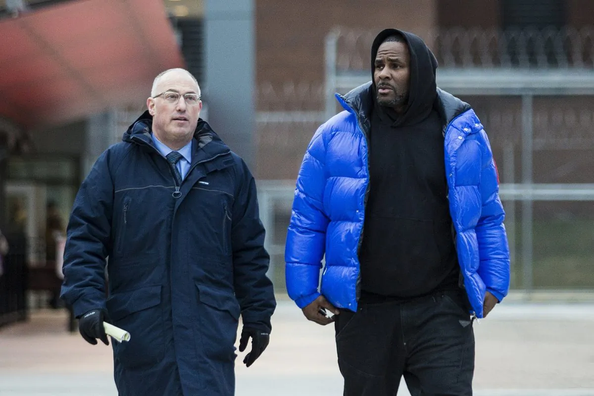 R. Kelly walks out of Cook County Jail with his defense attorney, Steve Greenberg, after posting $100,000 bail in Chicago, on Feb. 25, 2019. (Ashlee Rezin/Chicago Sun-Times via AP)