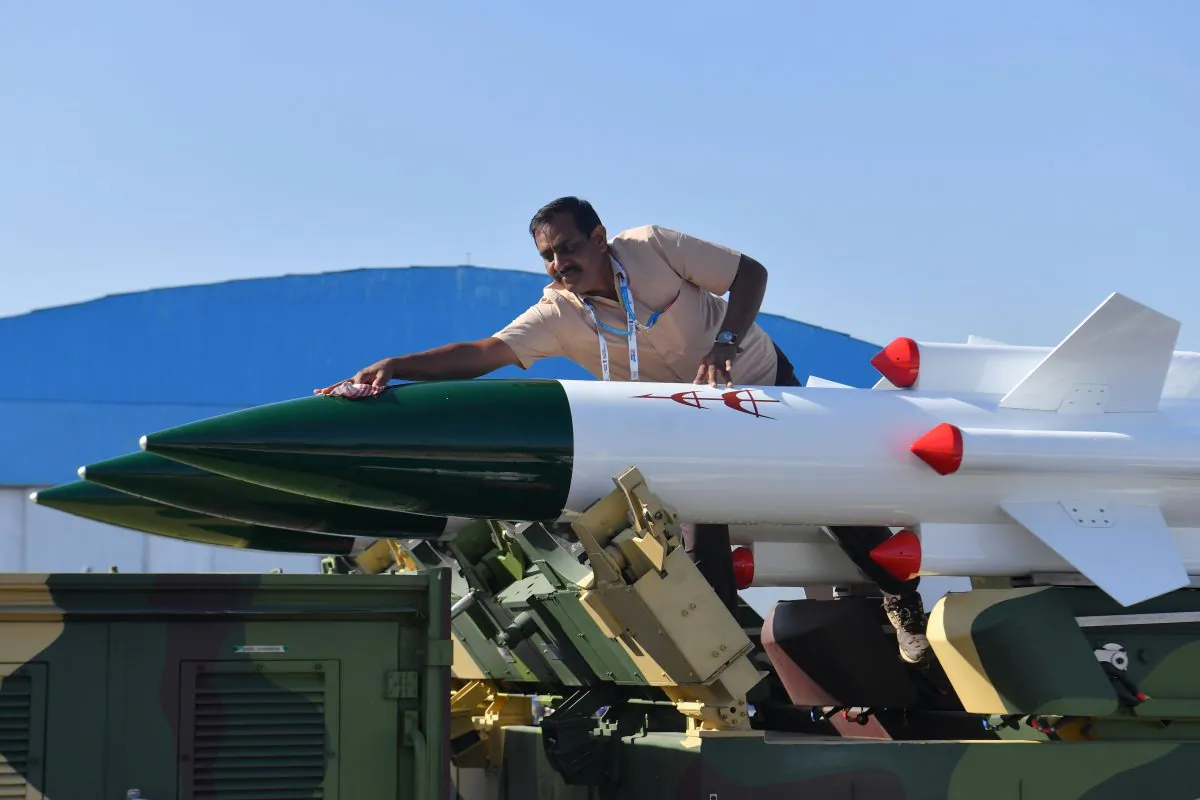A staffer cleans Akash, a medium-range mobile surface-to-air missile defense system developed by the Defence Research and Development Organisation (DRDO), on the second day of the 5-day Aero India airshow at the Yelahanka Air Force Station in Bangalore on Feb. 21, 2019. (Manjunath Kiran/AFP/Getty Images)
