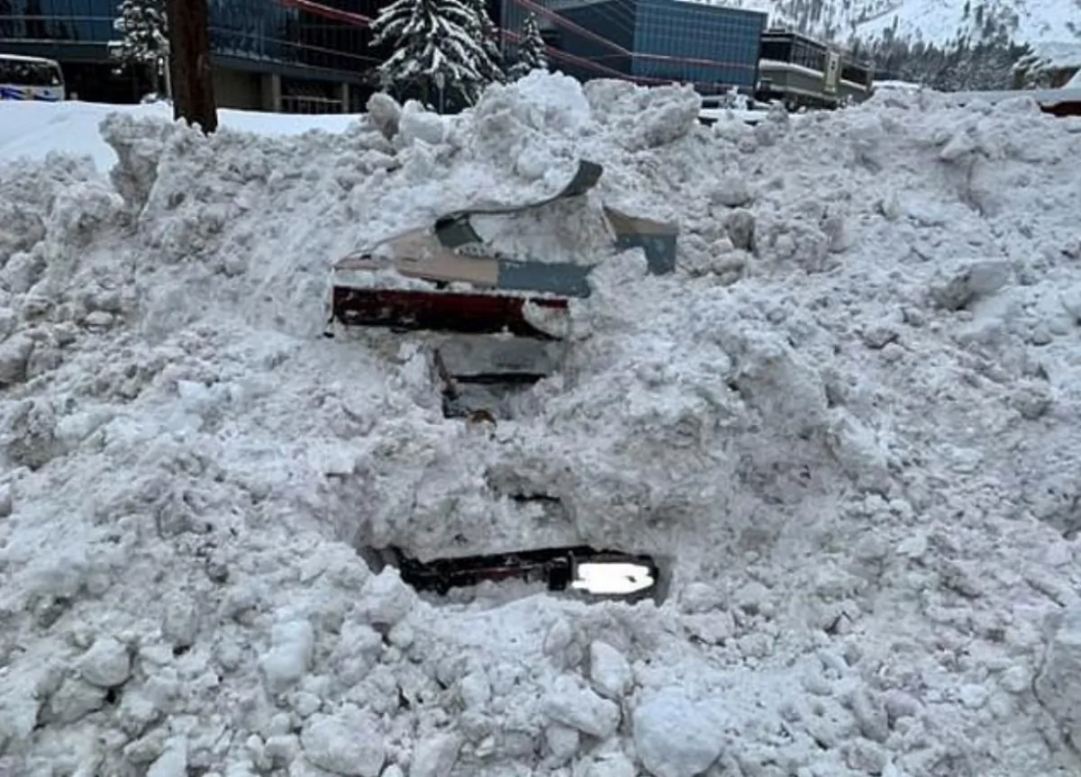 A snowplow struck a car that was completely buried by snow in South Lake Tahoe, California, on Feb. 17, 2019. Unbeknownst to crews, there was a woman inside. (City of South Lake Tahoe)