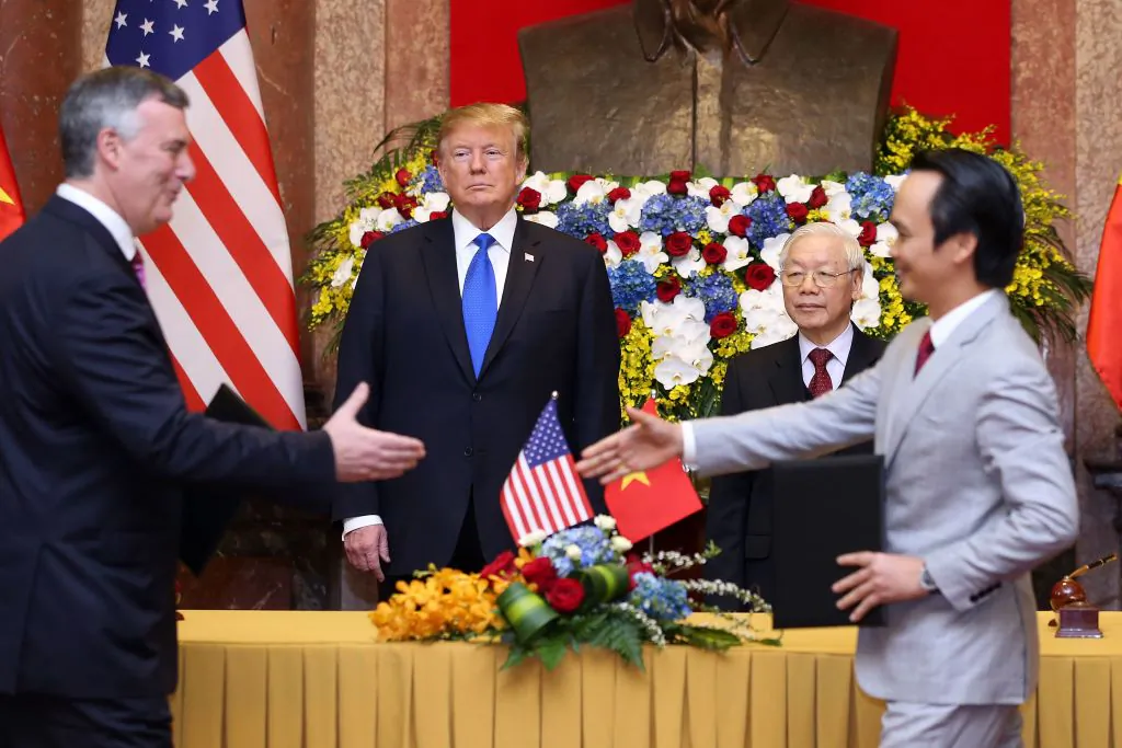 President Donald Trump (center L) and his Vietnamese counterpart Nguyen Phu Trong (center R) witness a signing ceremony between Chairman of Bamboo Airways Trinh Van Quyet (R) and President and CEO of Boeing Commercial Airplanes Kevin McAllister (L) at the Presidential Palace in Hanoi on Feb. 27, 2019. (LUONG THAI LINH/AFP/Getty Images)