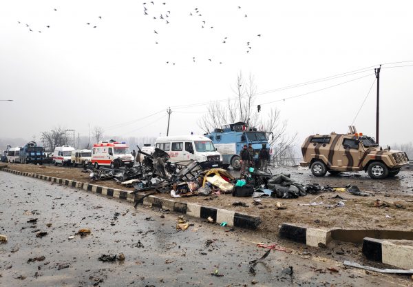 Indian soldiers examine the debris after an explosion in Lethpora in south Kashmir's Pulwama district