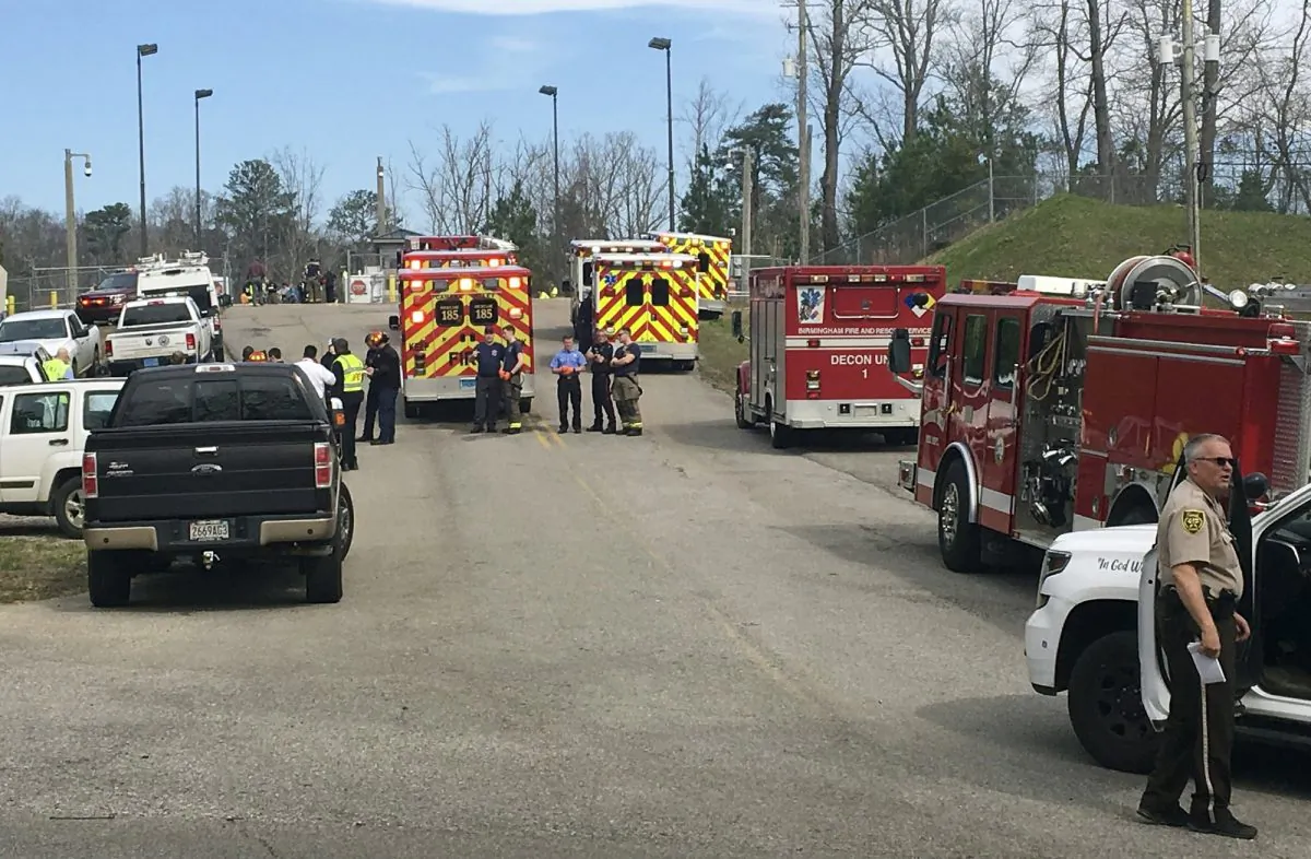 Emergency personnel gather near Birmingham Water Works where a chemical spill sent more than 50 people to the hospital, on Feb. 27, 2019. (Anna Beam/The Birmingham News via AP)