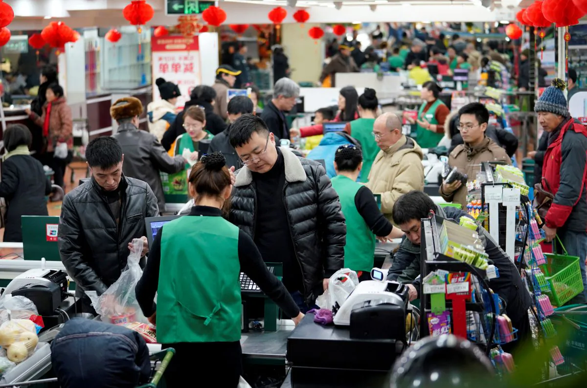 Customers are seen in a supermarket in Beijing, on Feb. 4, 2018. (Jason Lee/Reuters)