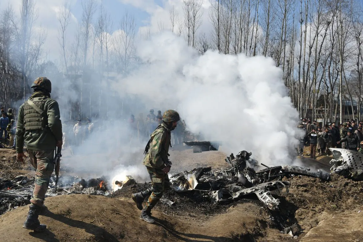 Indian soldiers inspect the remains of an Indian Air Force helicopter after it crashed in Budgam district, outside Srinagar on Feb. 27, 2019. (TAUSEEF MUSTAFA/AFP/Getty Images)