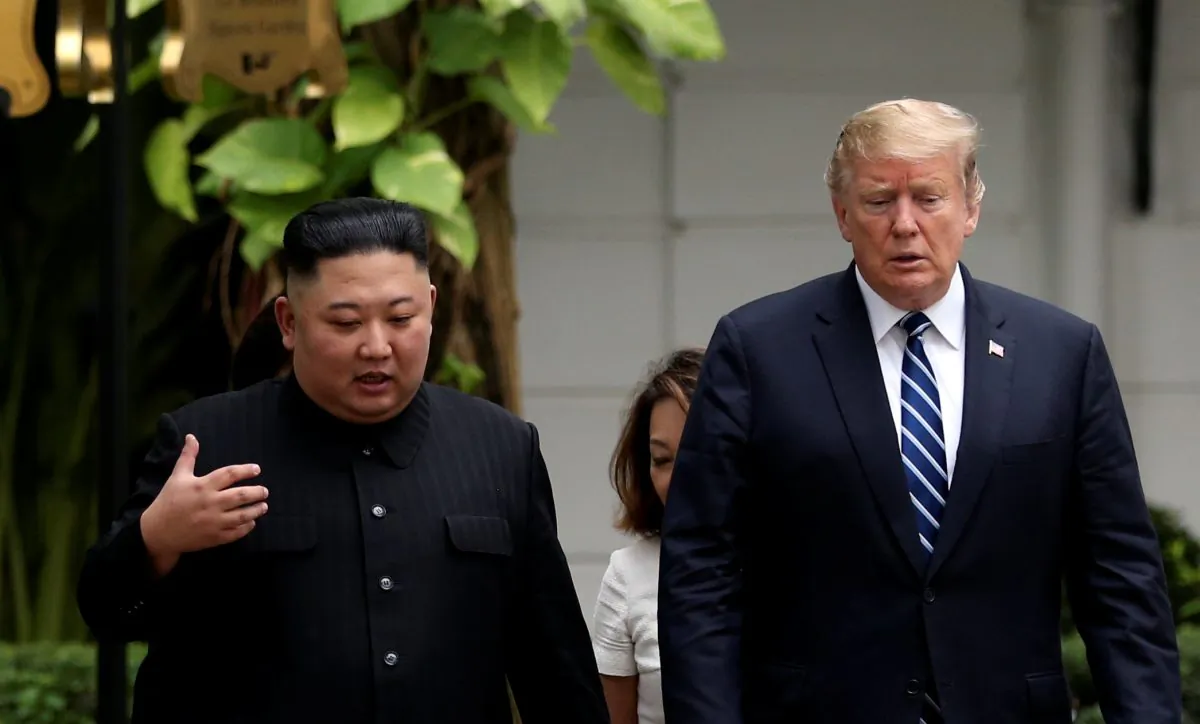 North Korea's leader Kim Jong Un and President Donald Trump talk in the garden of the Metropole hotel during the second North Korea-U.S. summit in Hanoi, Vietnam on Feb. 28, 2019. (Leah Millis/Reuters)