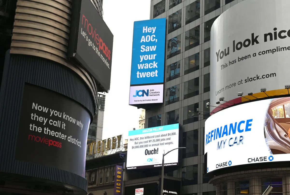 Signs placed by the Job Creators Network are seen on Times Square on Feb. 23, 2019 in New York calling out Rep. Alexandria Ocasio-Cortez for the role they say she played in the recent termination of Amazons HQ2.(Timothy A. Clary/AFP/Getty Images)