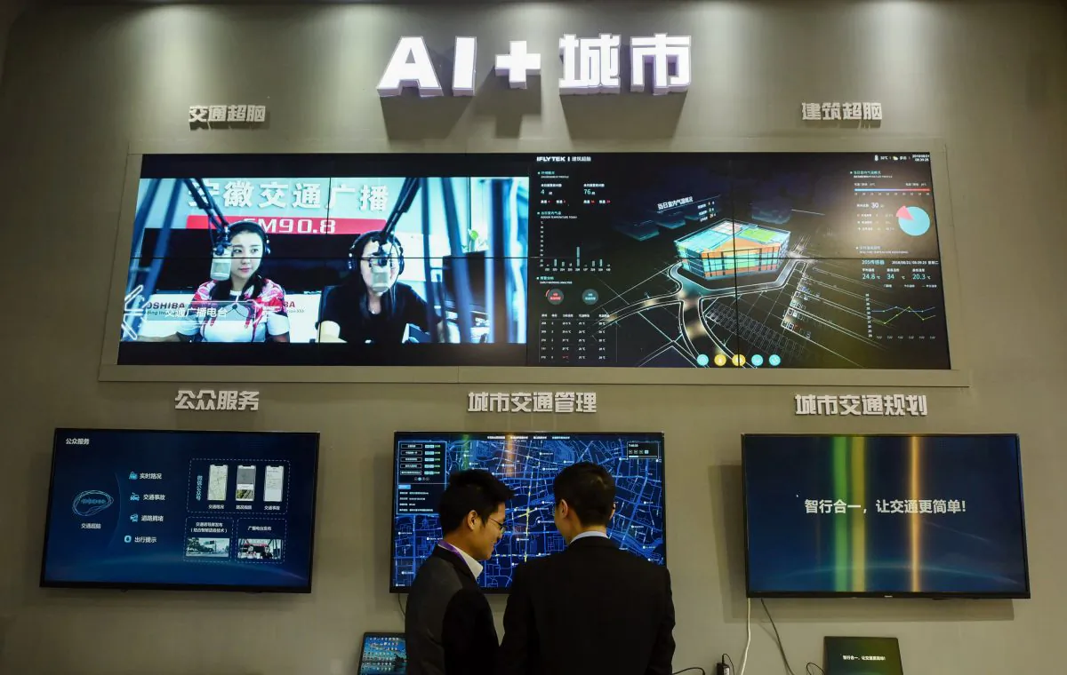 Visitors look at an AI smart city system by iFLY at the 2018 International Intelligent Transportation Industry Expo in Hangzhou in China's eastern Zhejiang province on December, 2018. (Photo by STR / AFP) / China OUT (Photo credit should read STR/AFP/Getty Images)