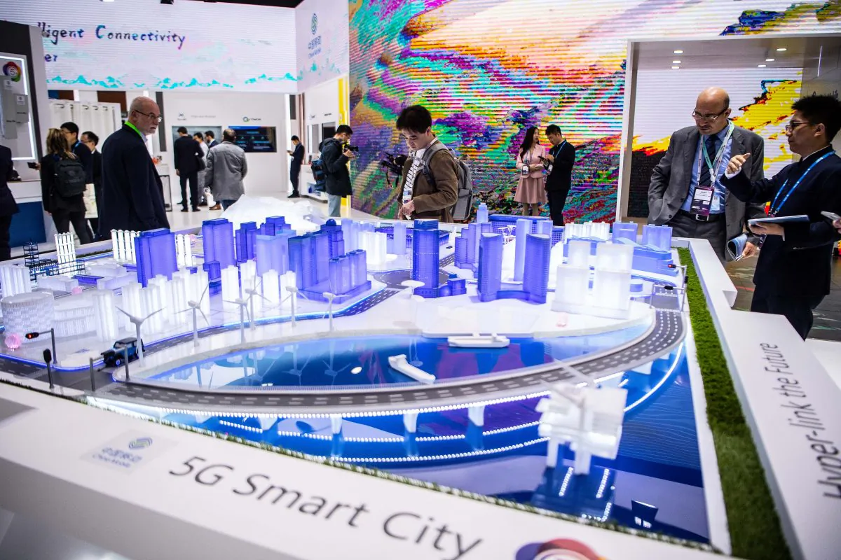 Visitors check a 5G Smart City technology at the China Mobile booth at the GSMA Mobile World Congress 2019 in Barcelona, Spain on Feb 26, 2019. The annual Mobile World Congress hosts some of the world's largest communications companies, with many unveiling their latest phones and wearables gadgets like foldable screens and the introduction of the 5G wireless networks. (David Ramos/Getty Images)