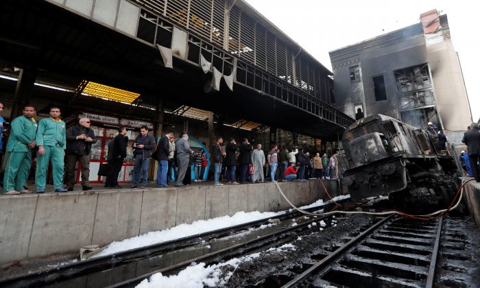 People gather at the main train station after a fire caused deaths and injuries, in Cairo, Egypt, Feb. 27, 2019. (Amr Abdallah Dalsh/Reuters)