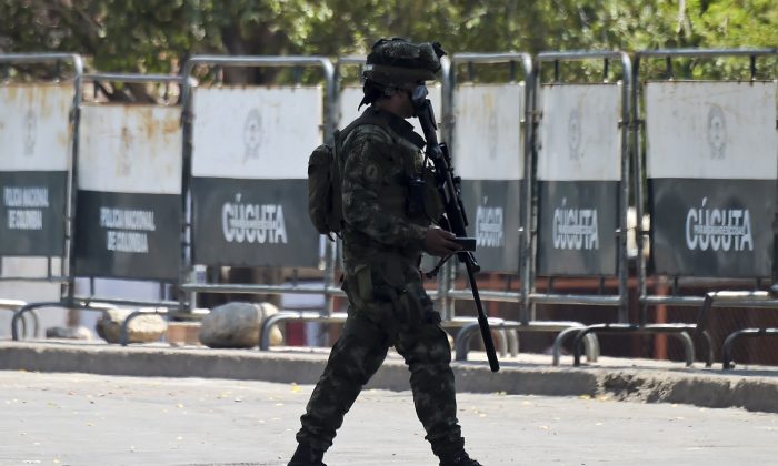 A Colombian soldier patrols the area around the the Simon Bolivar International Bridge in Cucuta, Colombia, on the border with Venezuela on Feb. 26, 2019. The Colombian government closed the area at least until midnight. (RAUL ARBOLEDA/AFP/Getty Images)