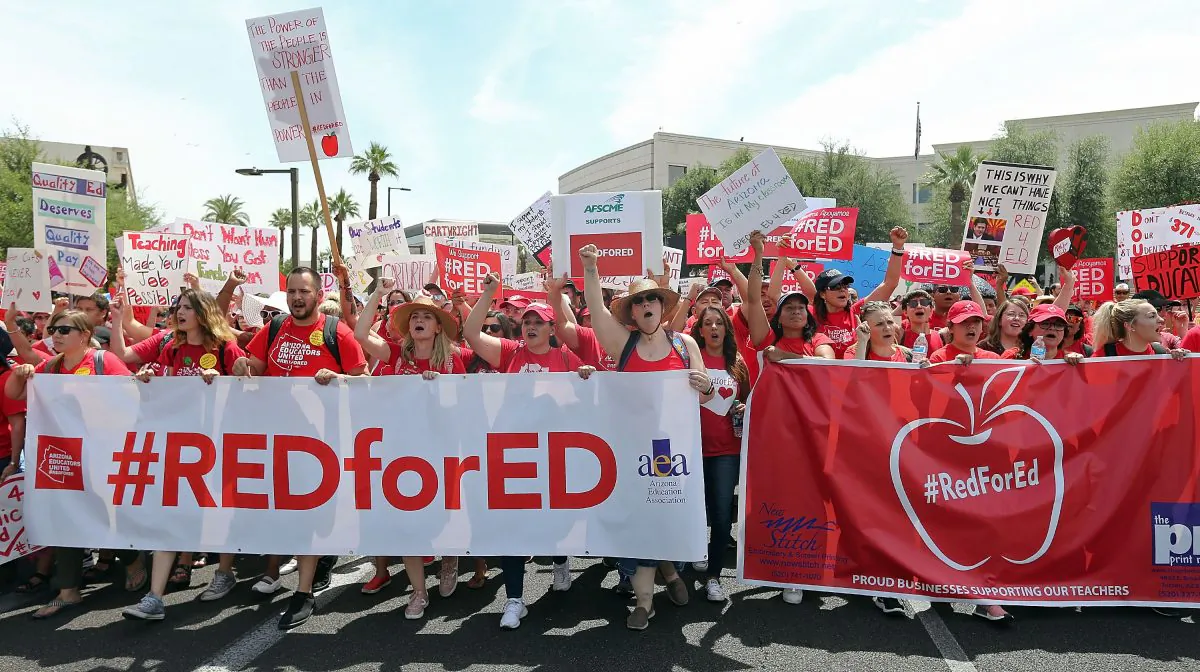 Arizona teachers march through downtown Phoenix on their way to the State Capitol as part of a rally for the #REDforED movement in Phoenix, Arizona on April 26, 2018. (Ralph Freso/Getty Images)