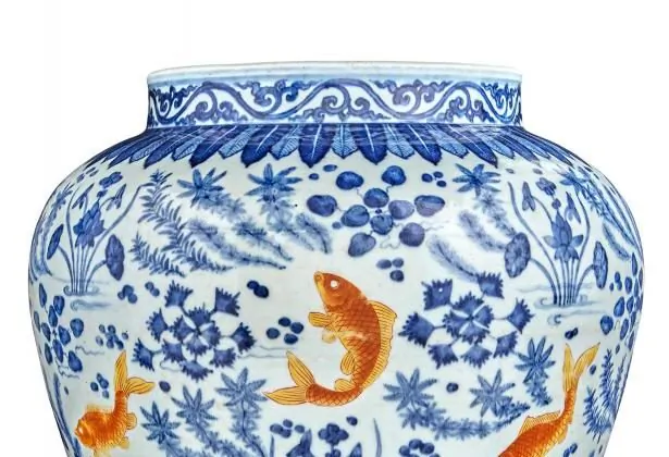 Chinese Underglazed Blue and Iron Red Porcelain Fish Jar. This potted jar is painted in the round with eight iron-red carp swimming amid lotus blossoms and water weeds. Qing Dynasty, Height 12 3/8 inches. This jar is being auctioned by Doyle New York on March 18 for an estimated $20,000 to $30,000. (Courtesy of Doyle New York)